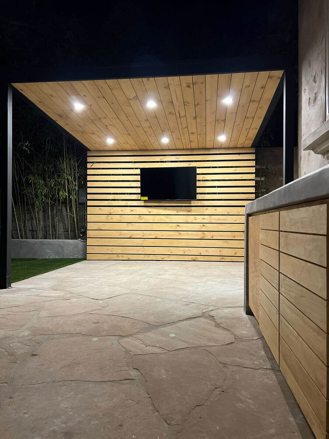 Custom covered patio with recessed lighting in Saratoga, CA