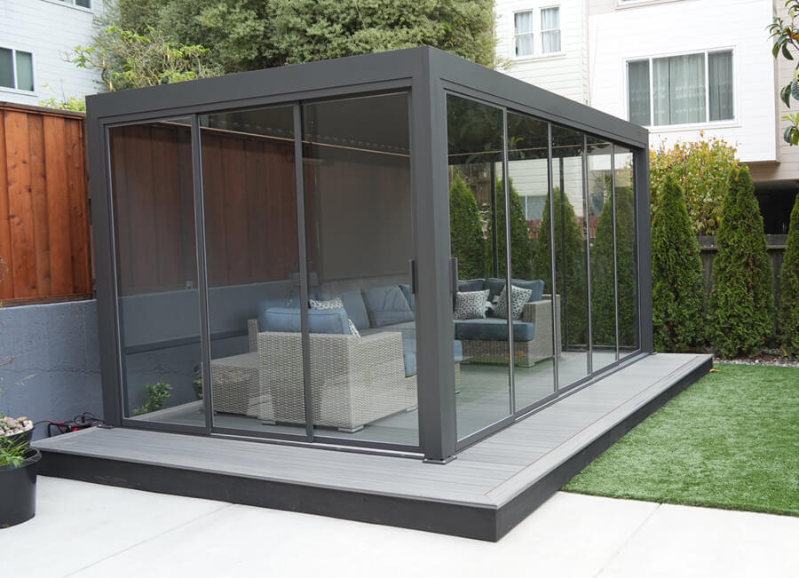 Modern glass-enclosed pergola on a composite deck in San Mateo, California