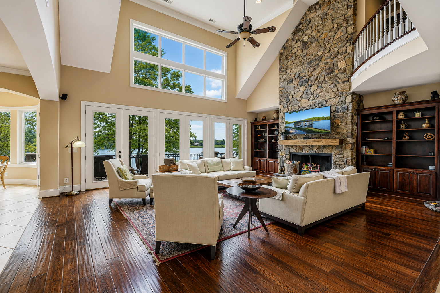 Vaulted lakeside living room with expansive windows