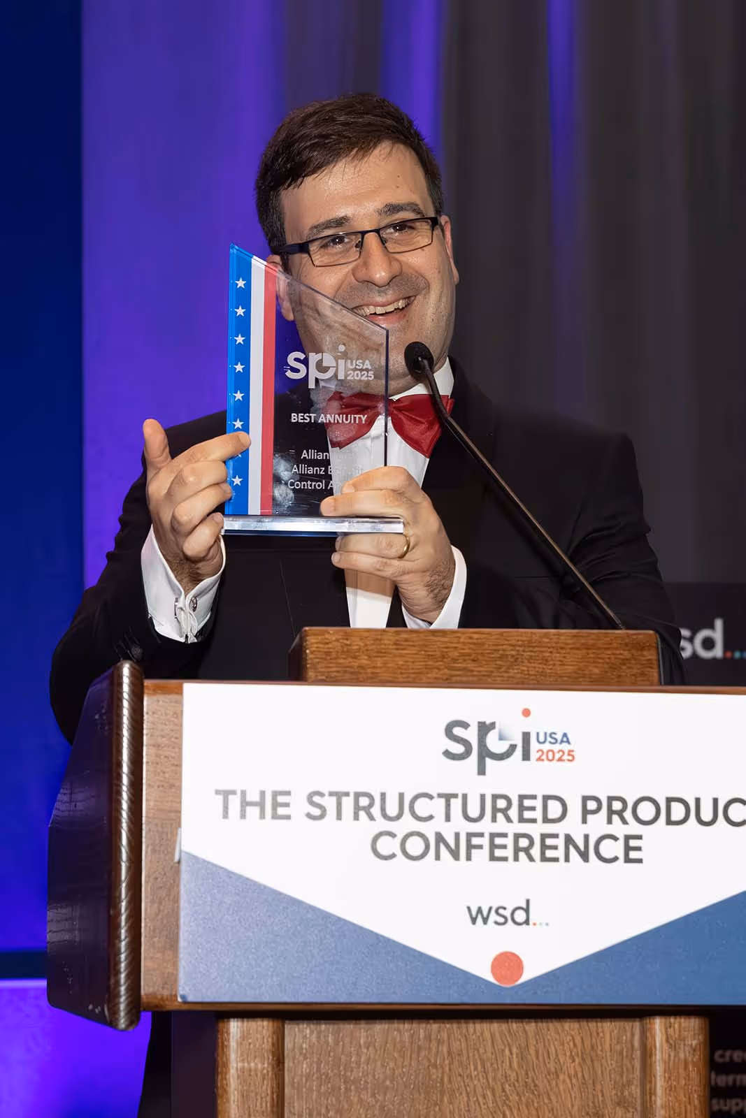 Tiago Fernandes, Head of SPI at WSD presenting awards at SPI USA 2025, the Structured Products Conference.
