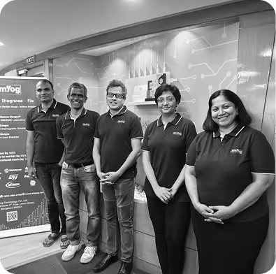 Five people standing in a row indoors, all wearing matching branded polo shirts.
