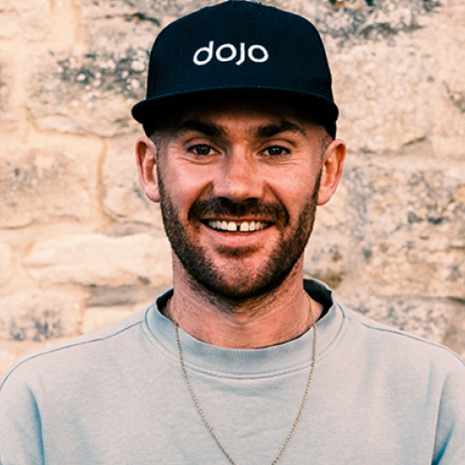 Headshot of Tom Voller, Dojo Films co-founder, wearing a black cap with the Dojo logo