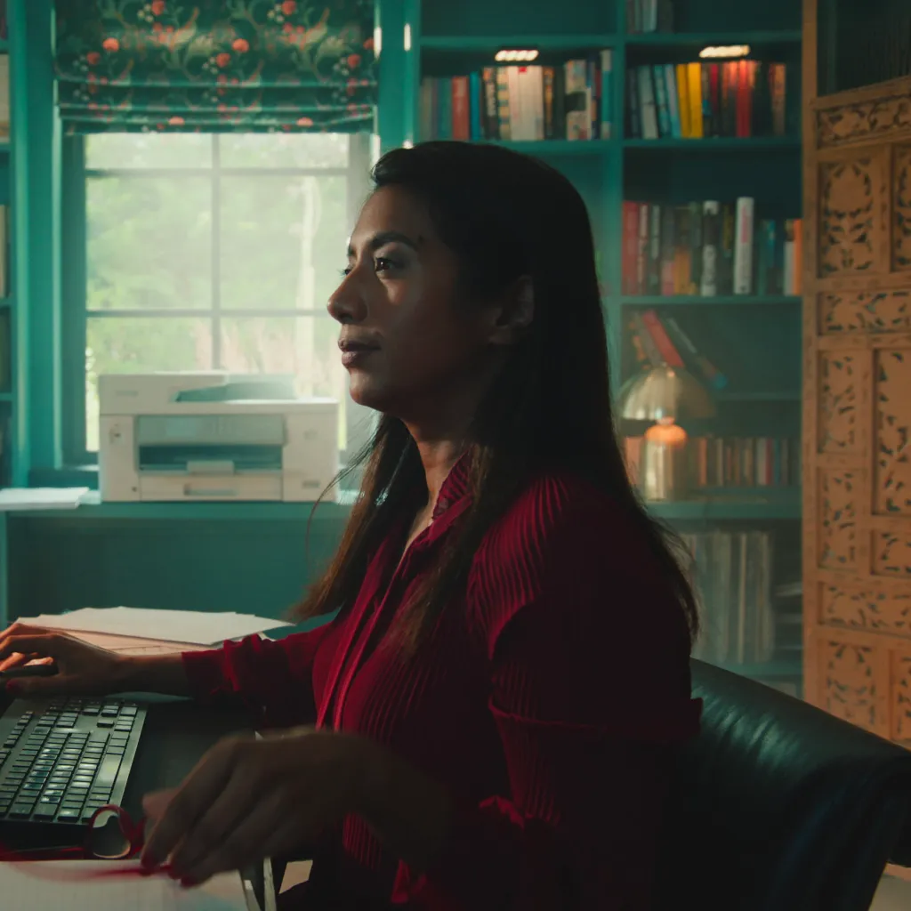 Video still from Dojo Films' 'Like No Other' case study showing a woman working at a desk in a stylish home office