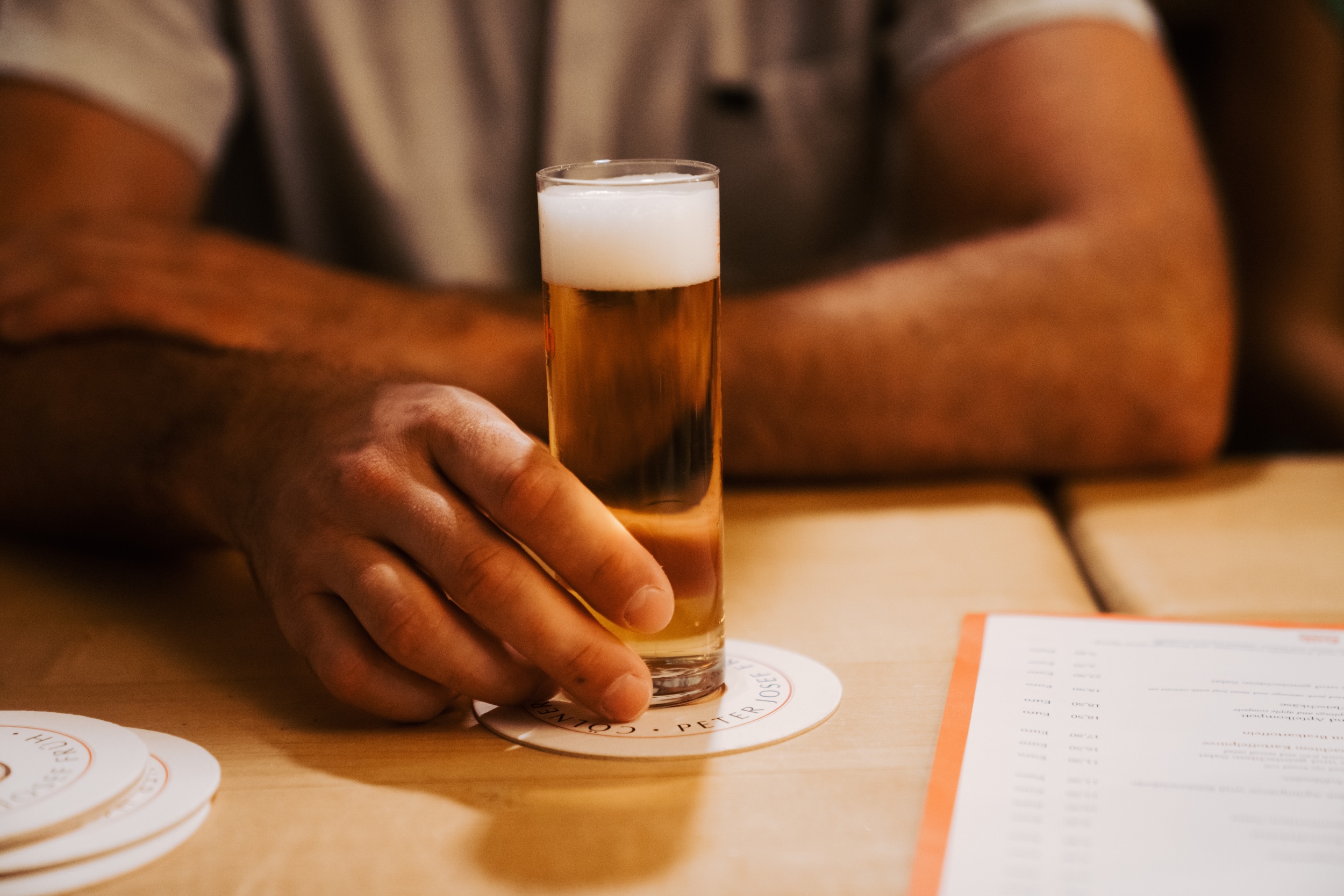Hands holding Koelsch Beer