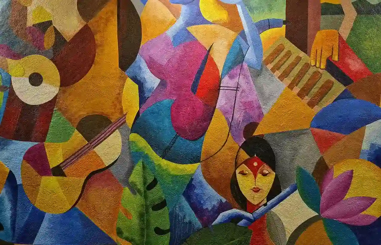 Colorful abstract mural with musical instruments, a woman's face, and vibrant shapes and patterns.