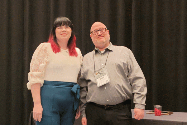 UNO doctoral student Krystyn Dupree accepts her student research grant award at the American College Counseling Association’s annual meeting.