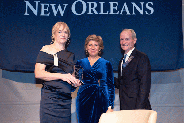 UNO alumna Sabrina Farmer (left) stands with President Kathy Johnson and Ricky Burke, president of the UNO Alumni Association, at the Distinguished Alumni Gala held Thursday, Nov. 9, 2023 at the National WWII Museum.