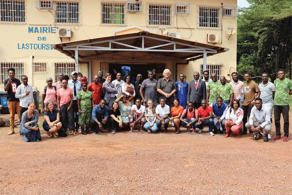 University of New Orleans biology professor Nicola Anthony, far left in blue, conducted research in Gabon, Africa as part of a field training school. This photo was taken in front of the mayor’s office in Lastourville.