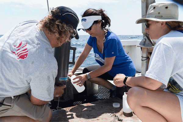 UNO biologist T. Erin Cox and members of her lab take water and sediment samples from artificial reefs off the coast of Alabama.