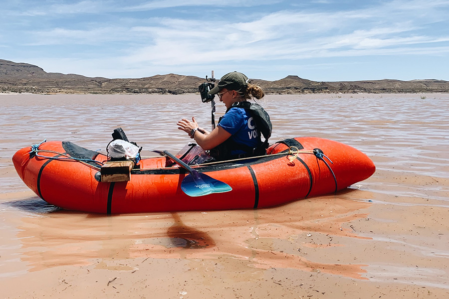 Abigail Eckland takes measurements in Elephant Butte Reservoir as part of her Ph.D. research.