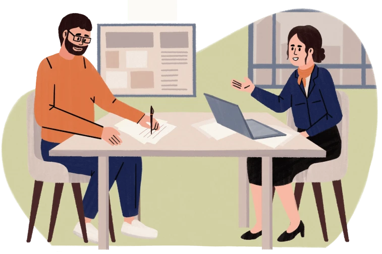 Man signing paper while woman talks, seated at a table with laptop in office setting.