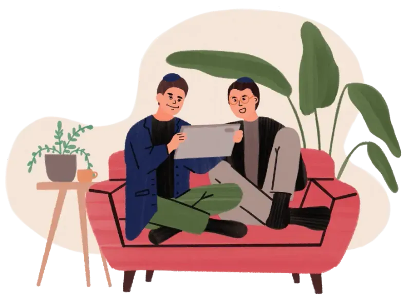 Two men sitting cross-legged on red couch looking at a tablet, with plants nearby.