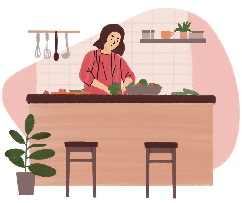 Woman preparing vegetables behind a kitchen counter with two stools and a potted plant.