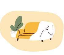 Yellow sofa with a white blanket draped on the right side and a green potted plant to its left.