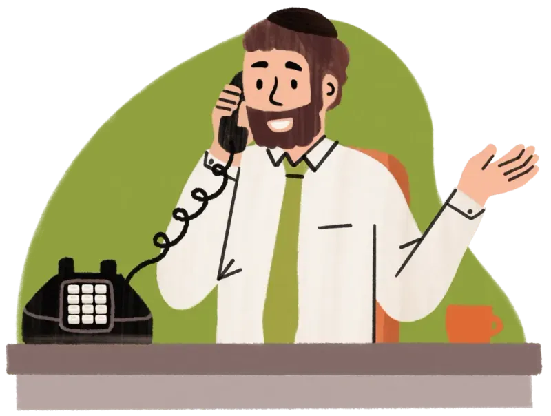 Man with beard and yarmulke talking on a corded phone at desk with orange cup.