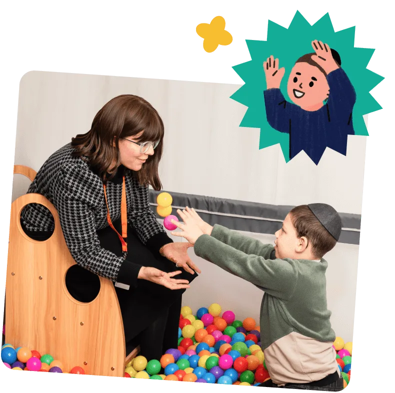 Woman and boy play with colorful balls in a ball pit, the woman reaching to catch a ball from the boy.