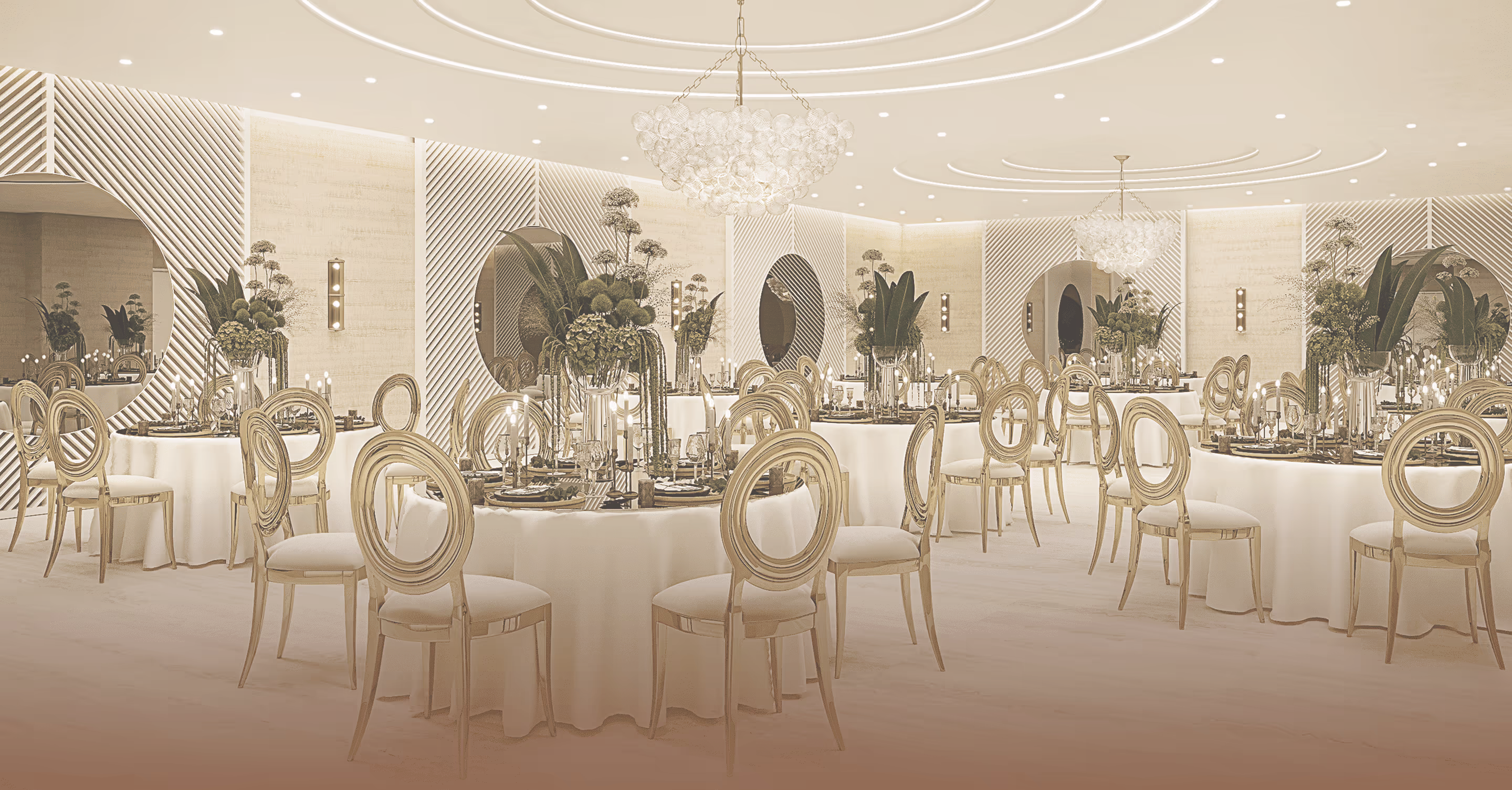 Luxurious banquet hall with round tables, ornate gold chairs, chandeliers, and floral centerpieces.