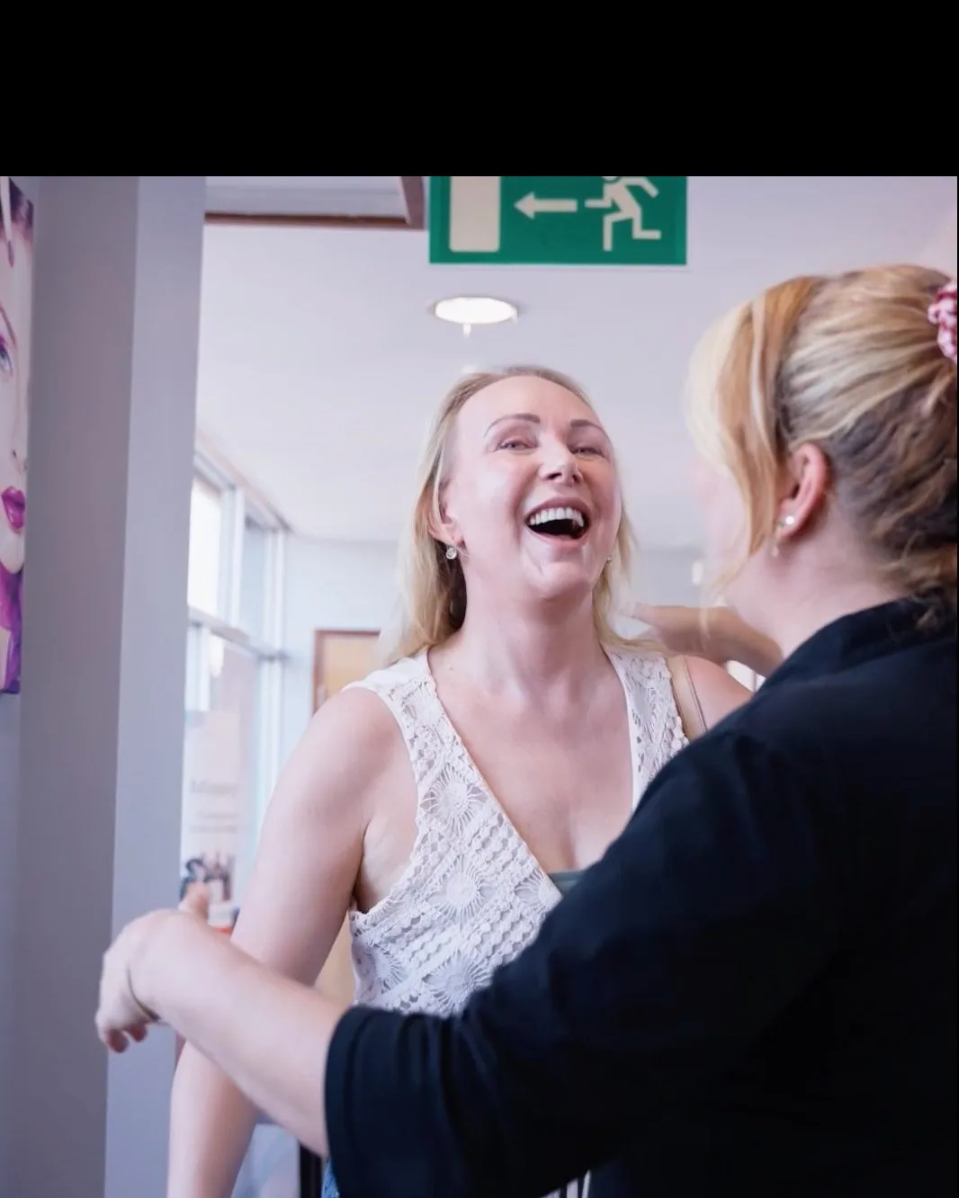 A patient being welcomed at the Sale Dental Spa reception