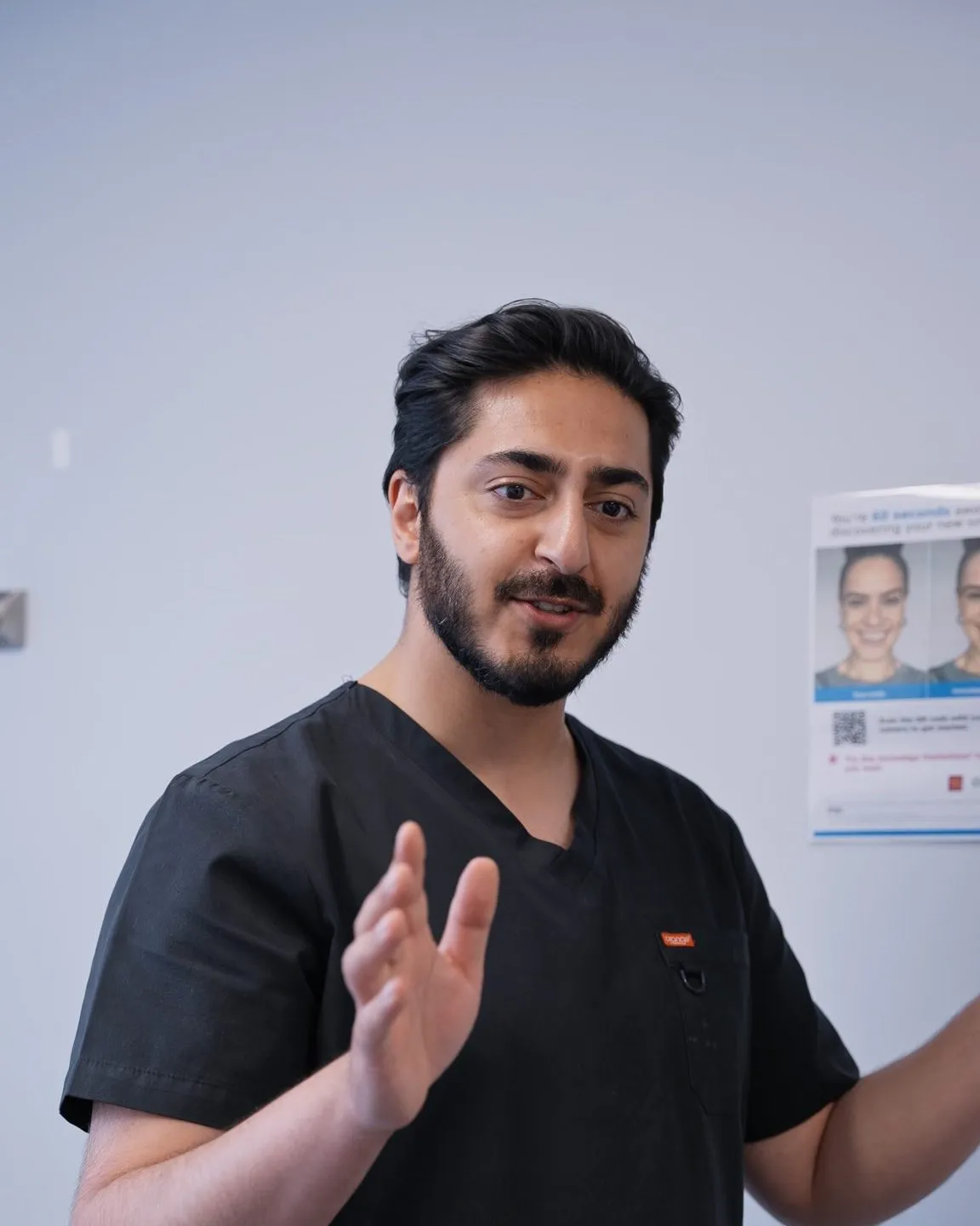 Dr Hamza talking a patient through their plan and pricing