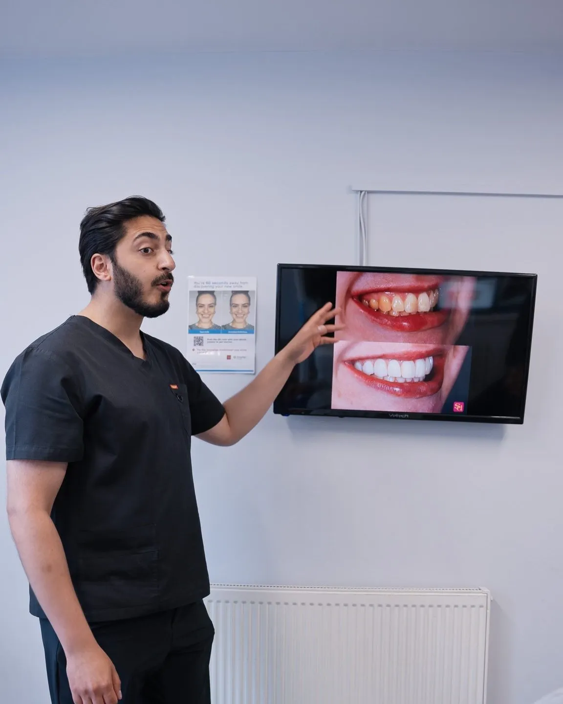 Dr Hamza Mirza reviewing before and after images on screen with a patient