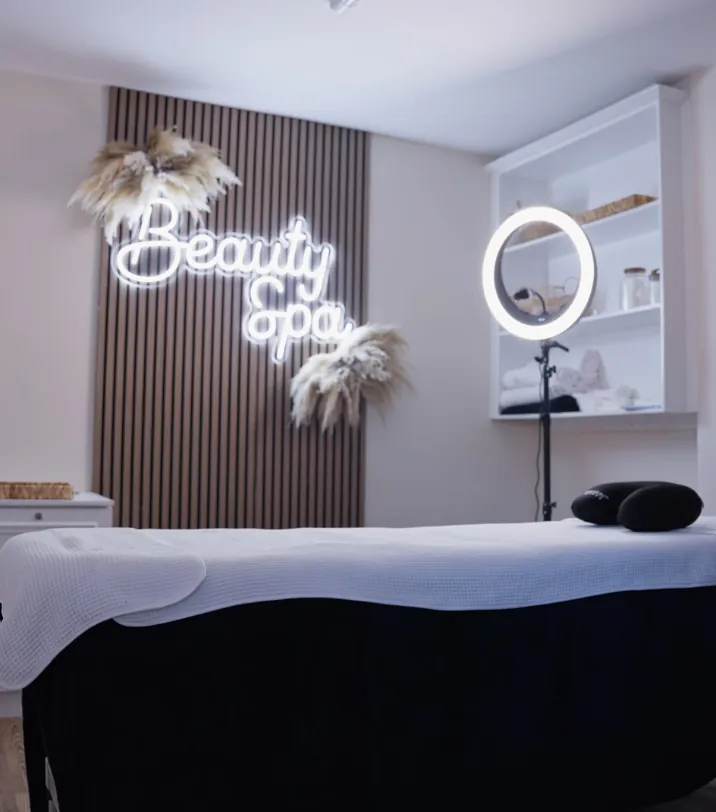 The Sale Beauty Spa treatment room at Sale Dental Spa, with its neon Beauty Spa sign