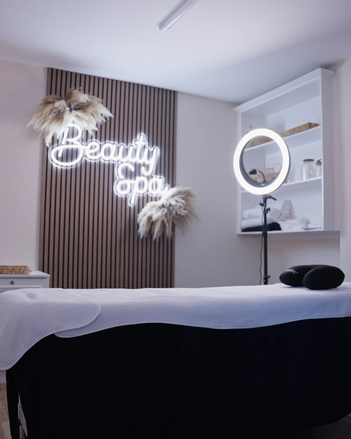 The Sale Beauty Spa treatment room inside Sale Dental Spa, with its neon Beauty Spa sign