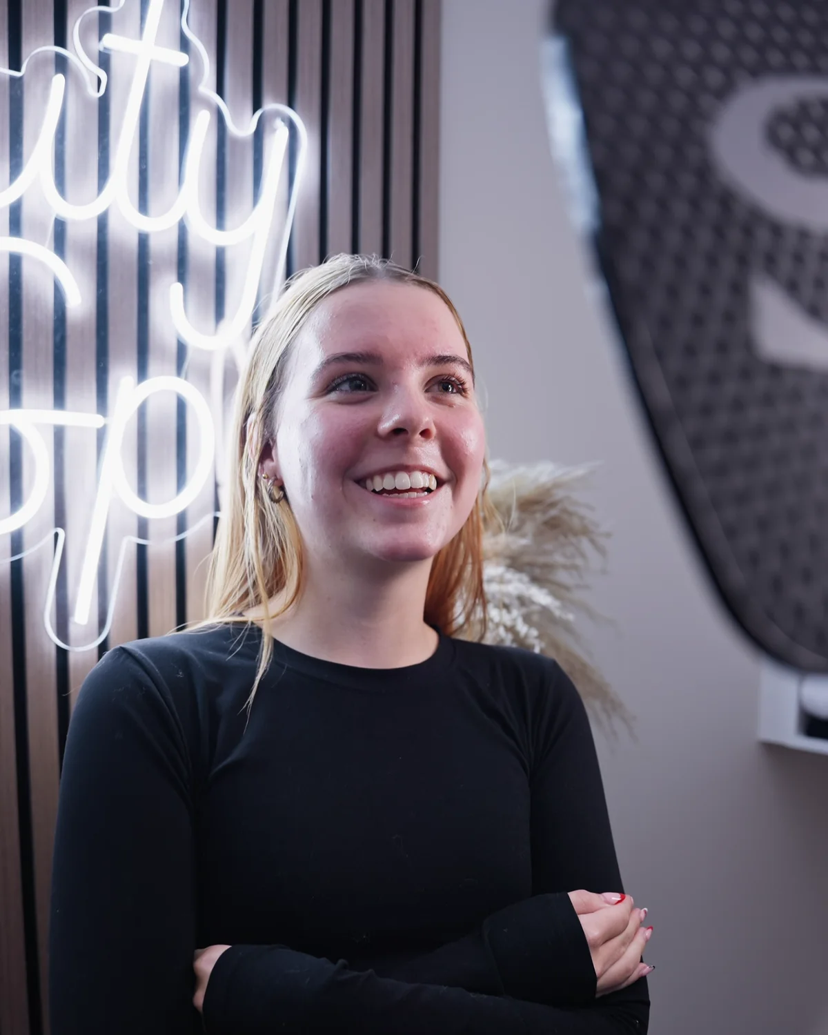 A client smiling in the Sale Beauty Spa treatment room
