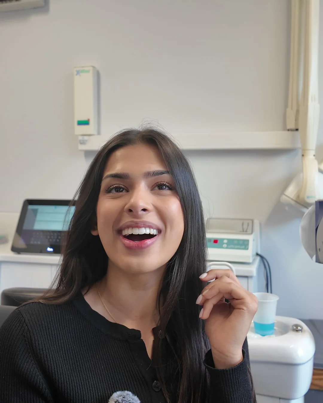 Patient smiling with a clear aligner at Sale Dental Spa