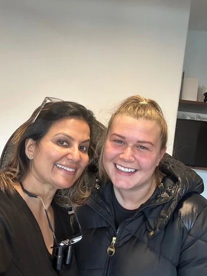 Dr Aisha Ahmed with a patient at Sale Dental Spa