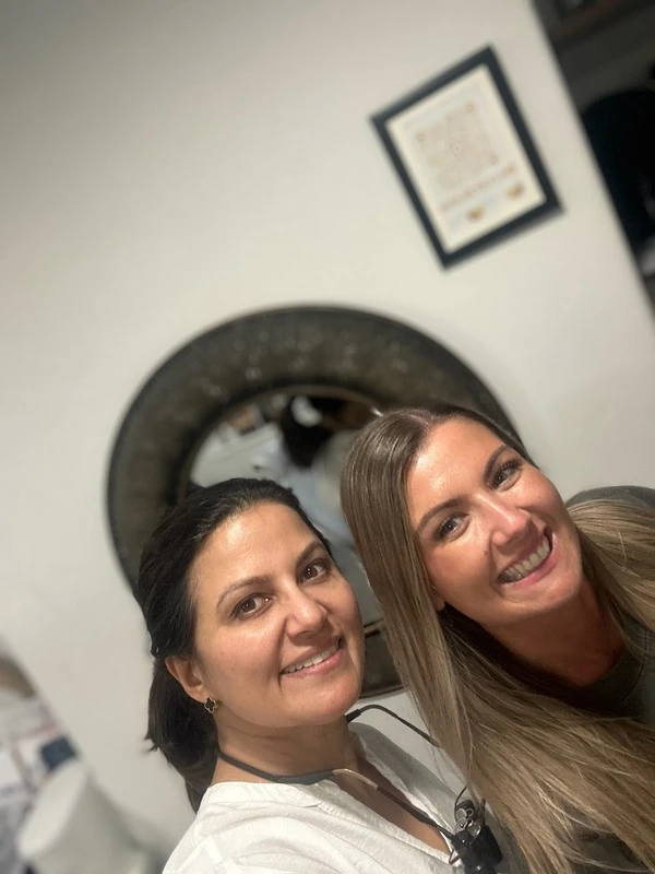Dr Aisha Ahmed with a patient at Sale Dental Spa