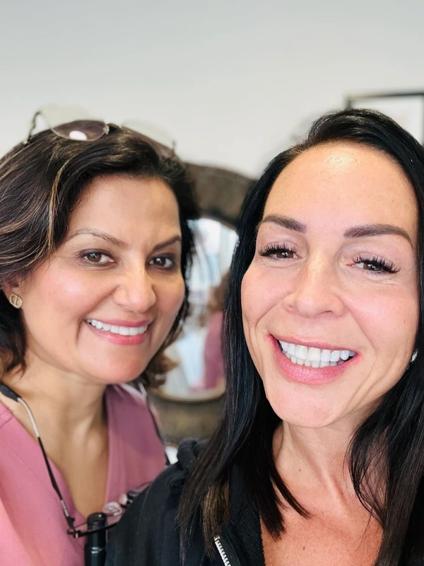 Dr Aisha Ahmed with a patient at Sale Dental Spa