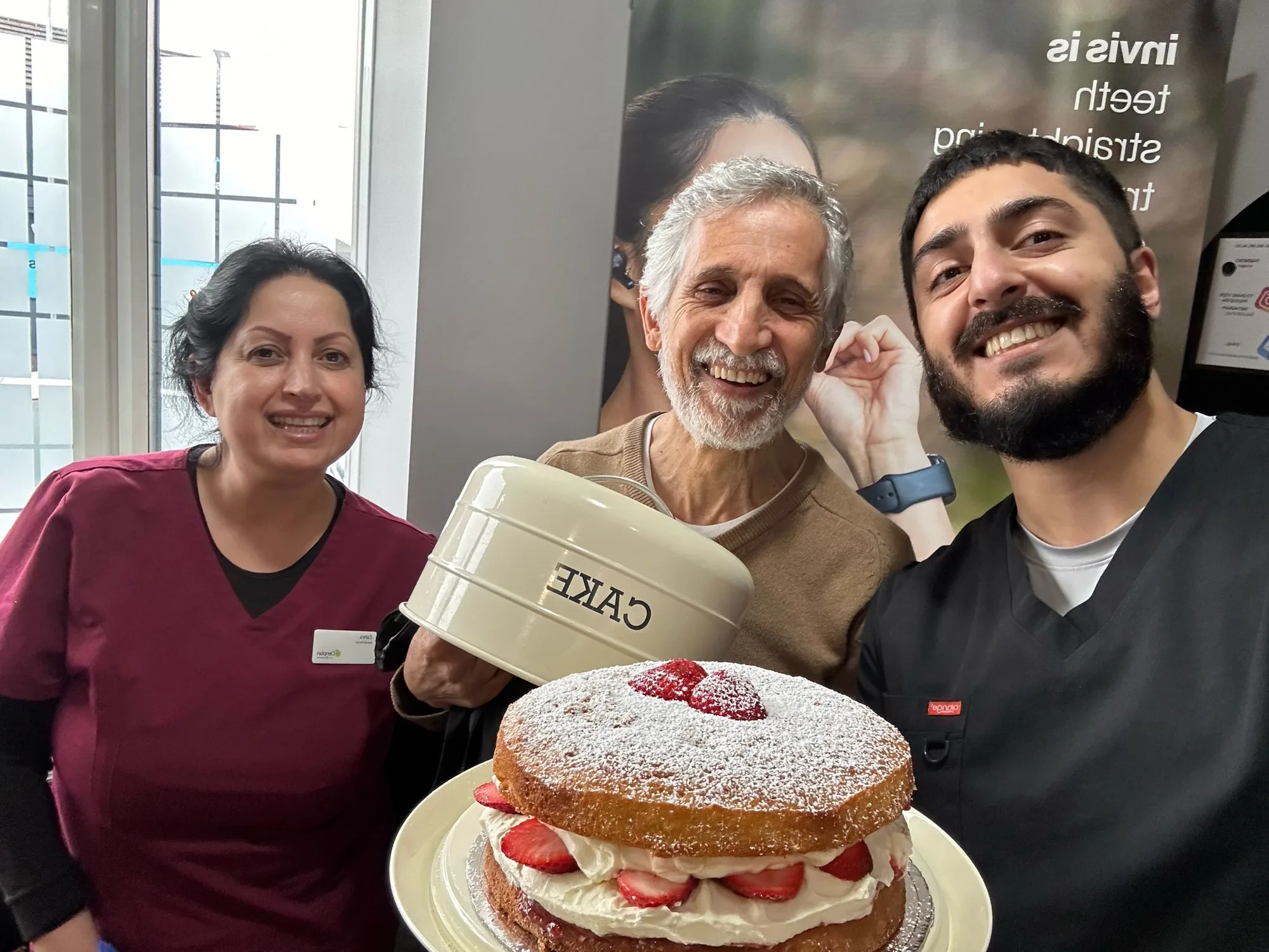 Dr Hamza and Zahra with a patient who brought the Sale Dental Spa team a cake
