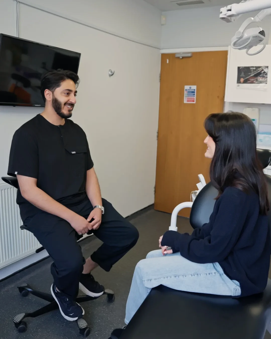 Dr Hamza Mirza talking a patient through her options