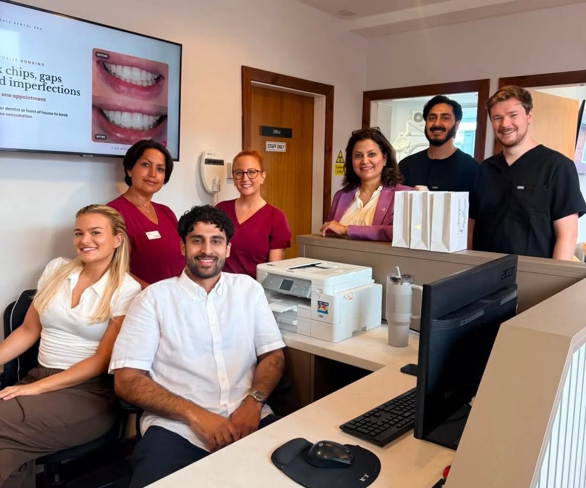 Dr Aisha Ahmed and the Sale Dental Spa team at the front desk
