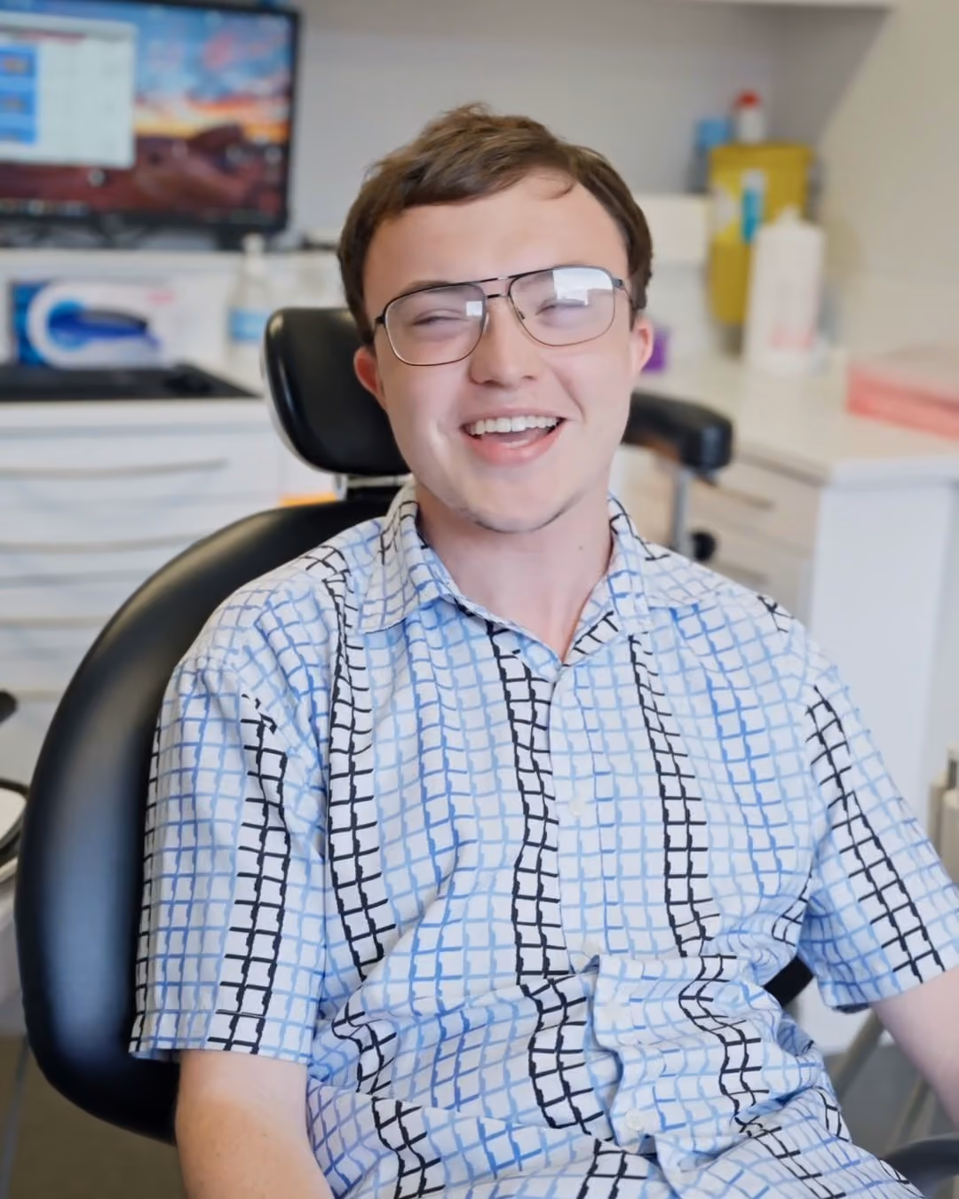 Owen smiling in the chair