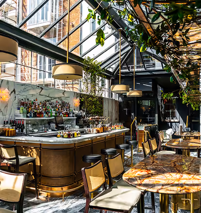 The Grayson's glass-roofed bar with marble counter and pendant lighting, St Stephen's Green