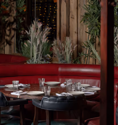 Mama Yo's dining room with red booth seating and dried floral décor, Camden Street
