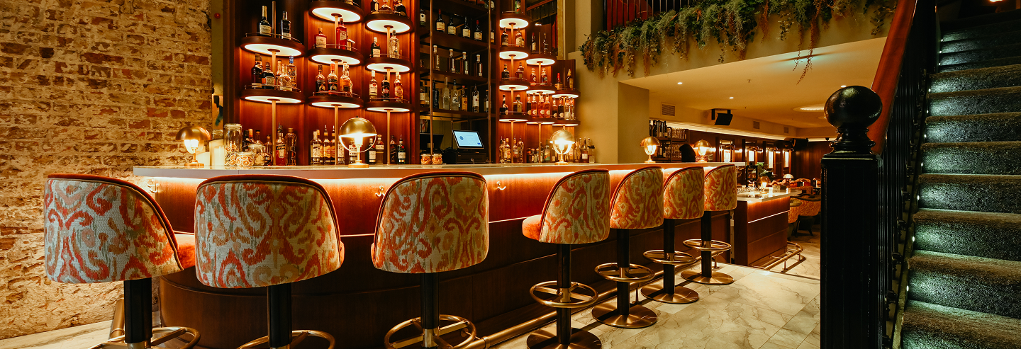 A low-lit Eclective bar room in Dublin