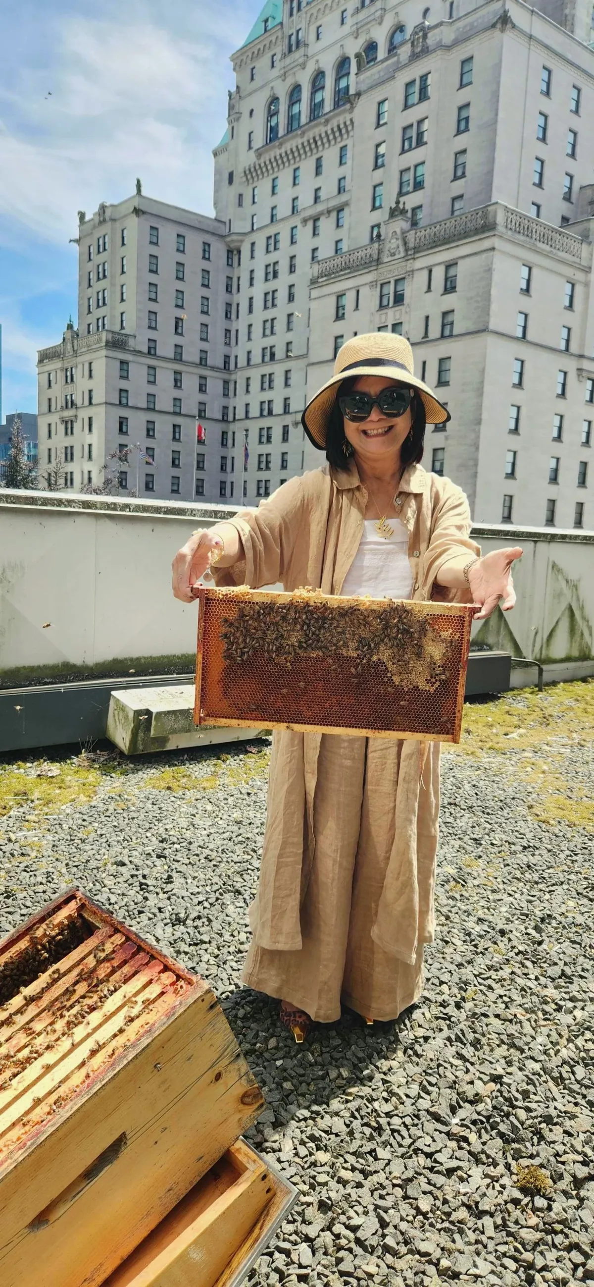 Alvéole beekeeper working on a rooftop hive