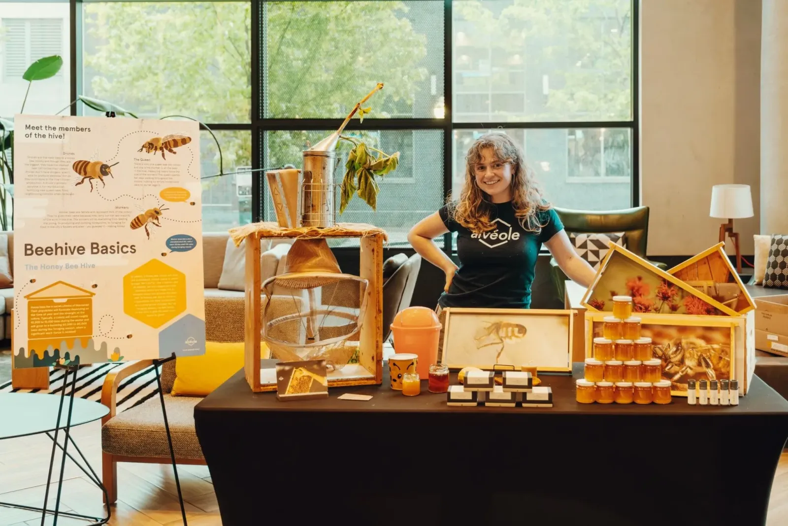 Alvéole beekeeping expert at a workshop booth engaging with tenants
