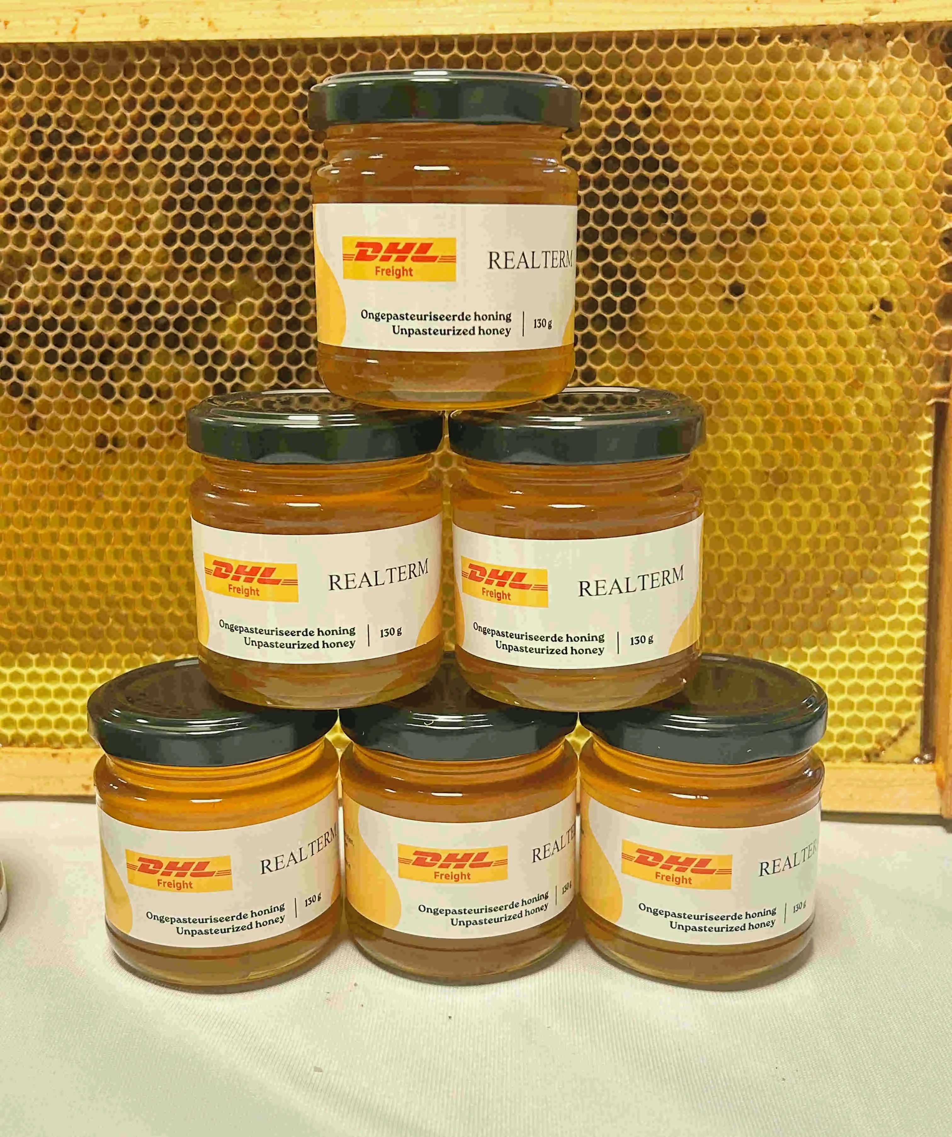 Alvéole branded honey jars at a Realterm DHL facility