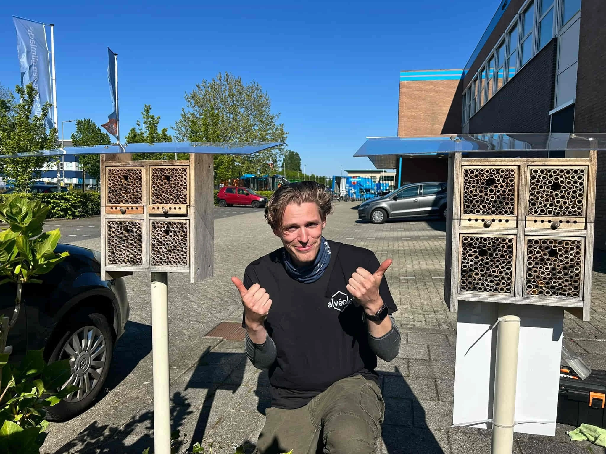 Alvéole installer setting up bee hotels at a Realterm property