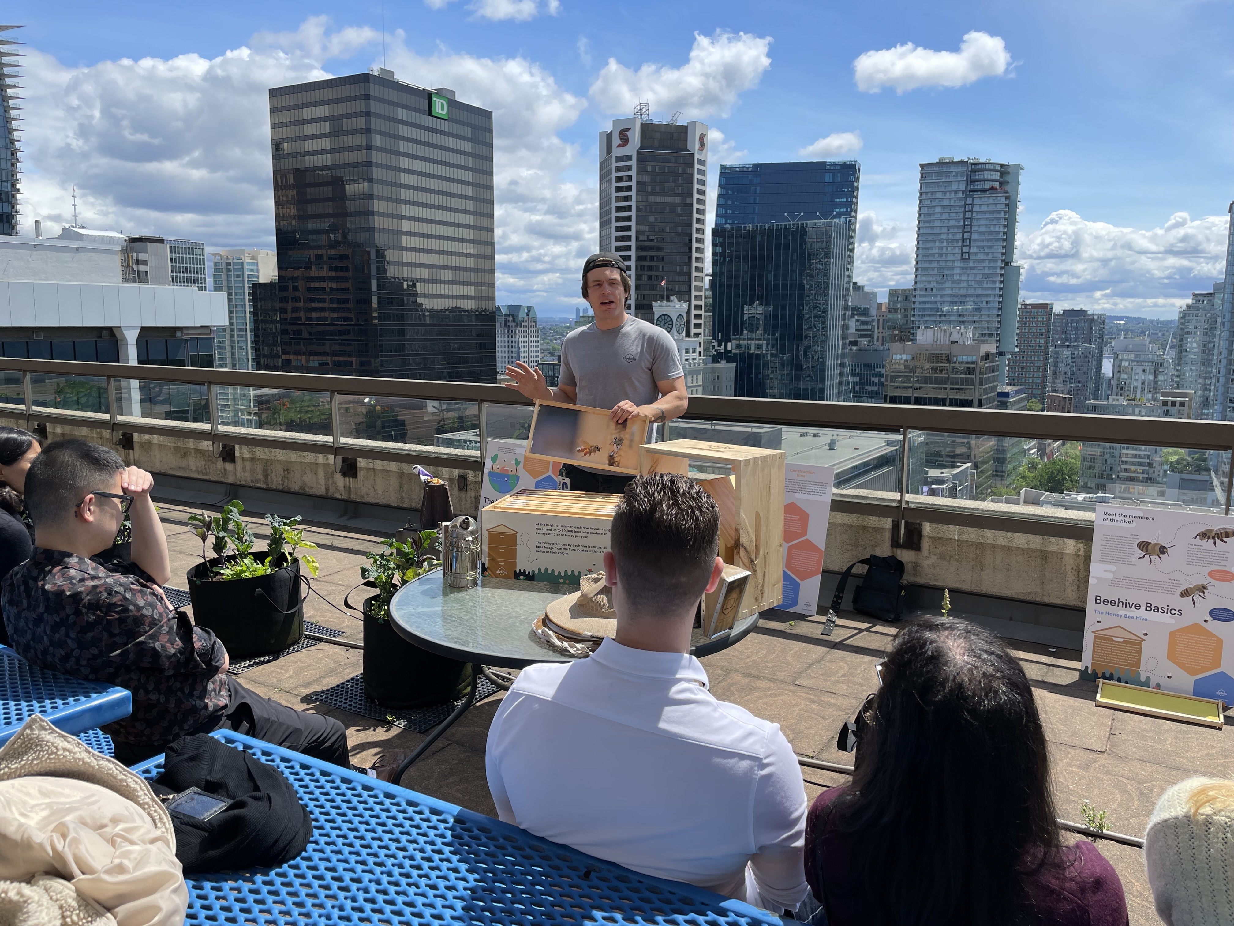 Alvéole beekeeper leading a rooftop beekeeping workshop for tenants in Vancouver