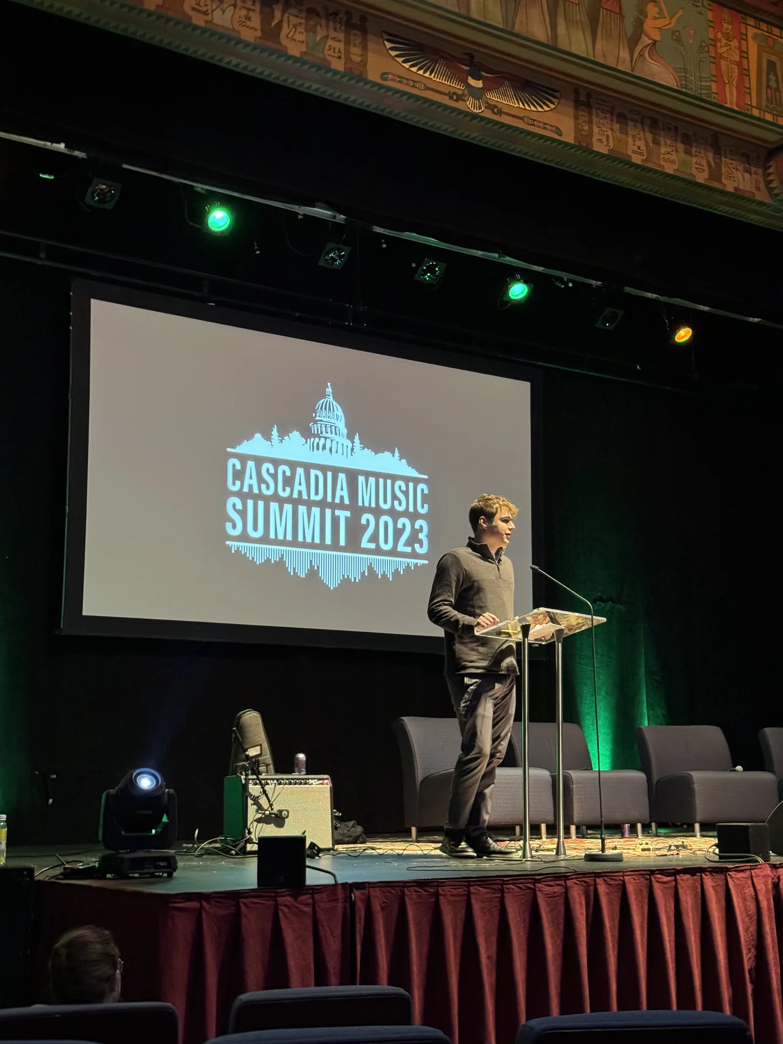 Speaking on stage at the Cascadia Music Summit 2023.