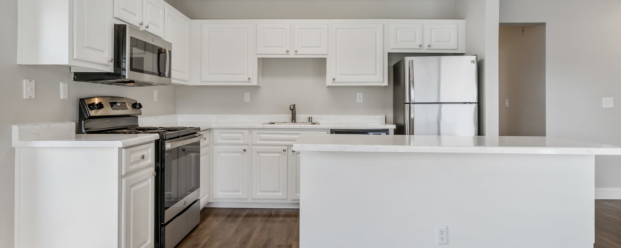 Kitchen with white cabinets and stainless steel appliances
