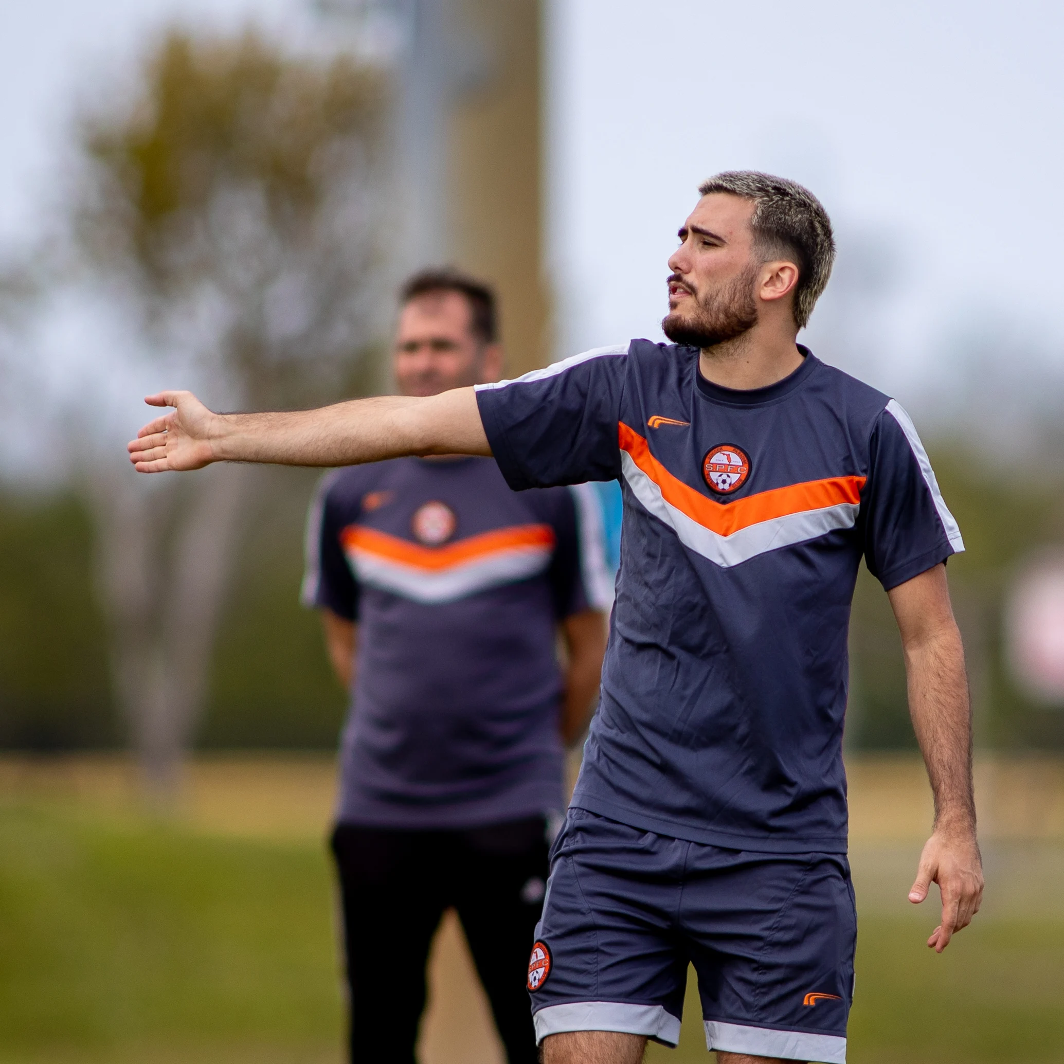 Agustin Cuina coaching players during a Soccer Paradise FC training session.