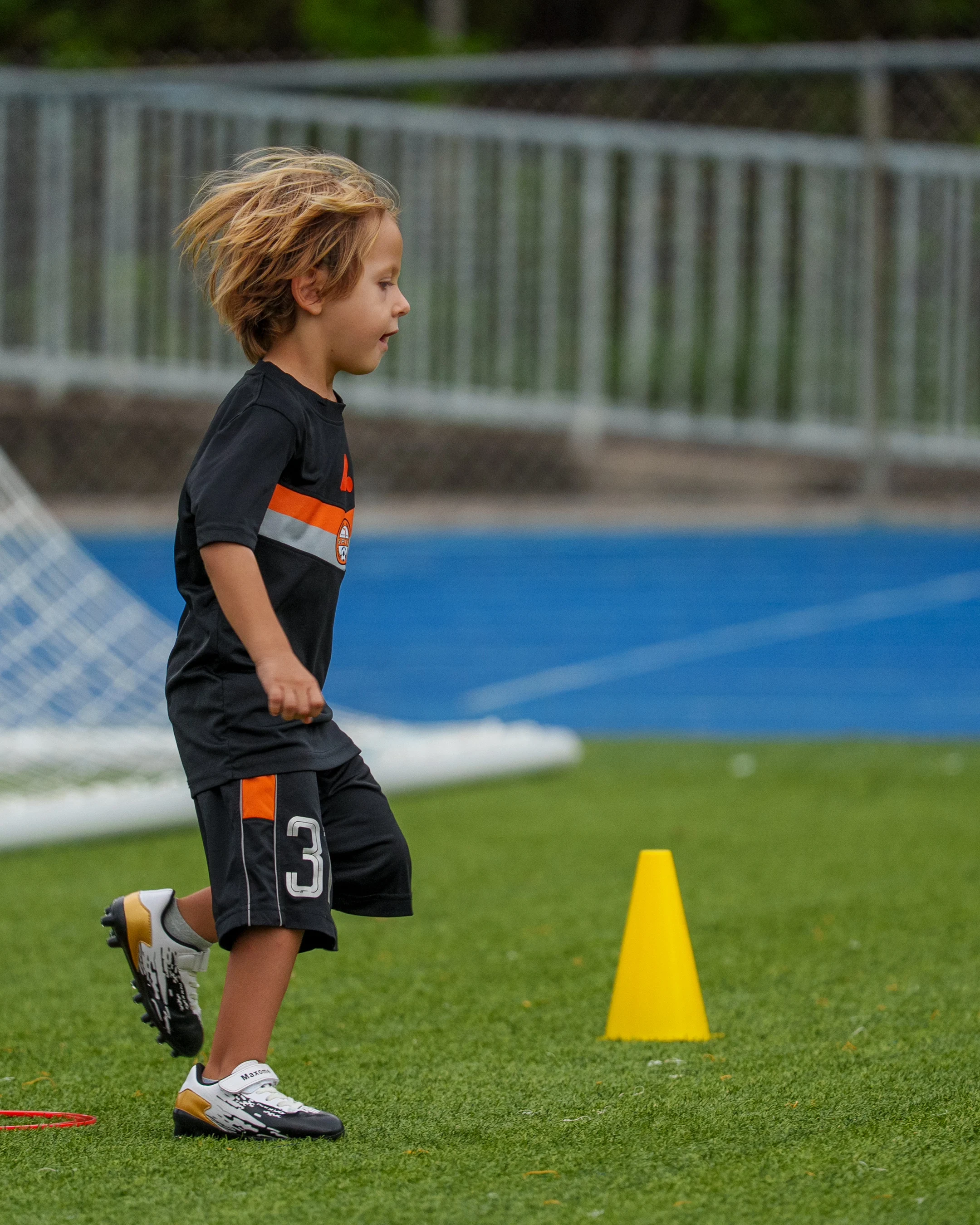 Children improving soccer skills during practice.