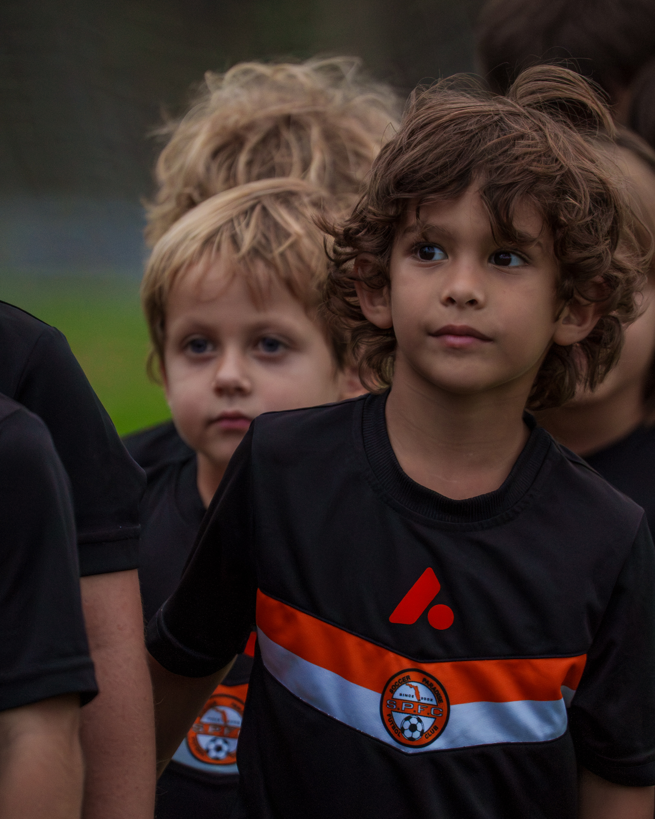 Children participating in a soccer training session.