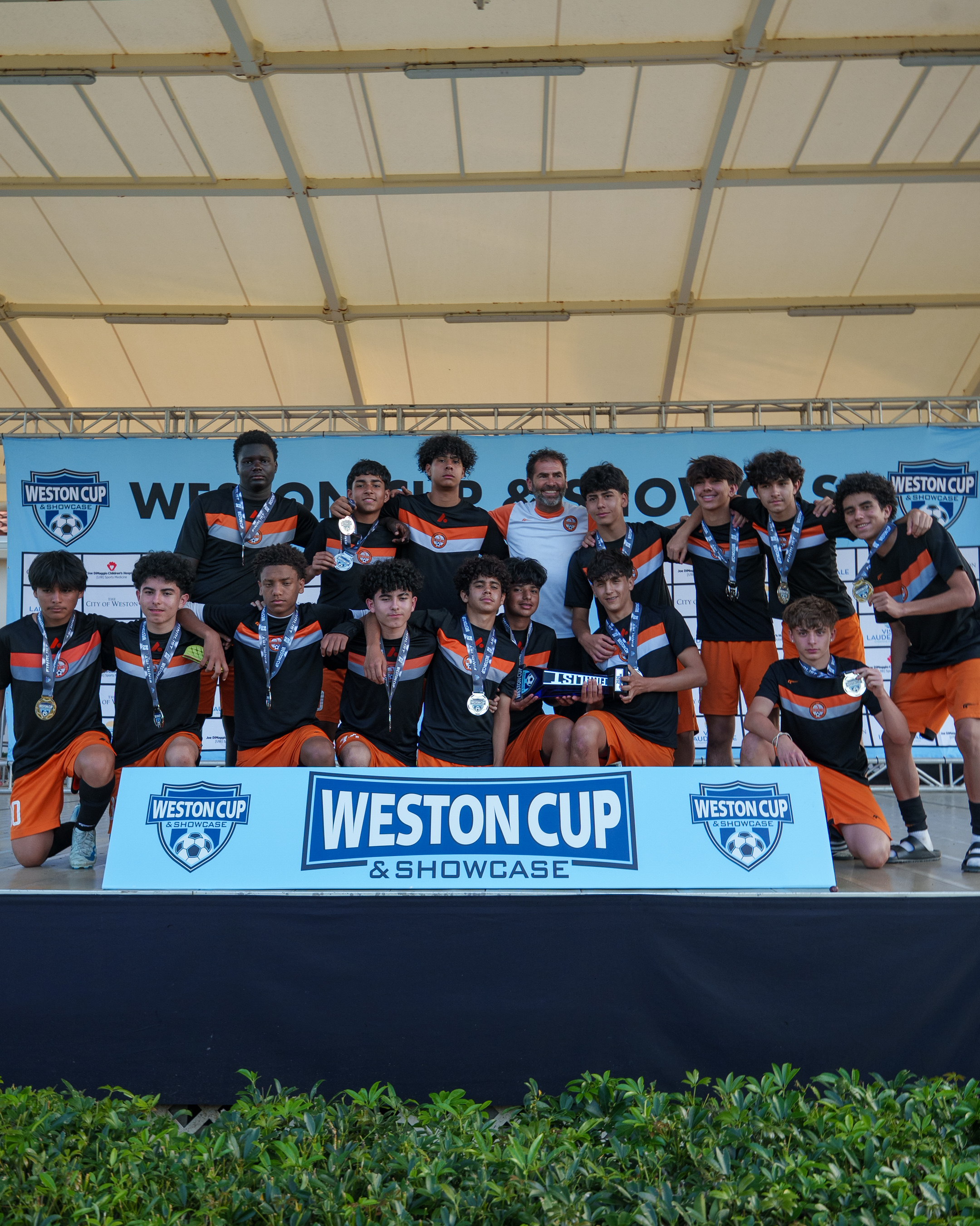 Youth soccer team posing for a group photo.