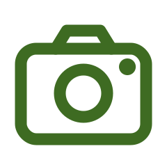 Simple green camera icon with rounded edges and a circular lens.